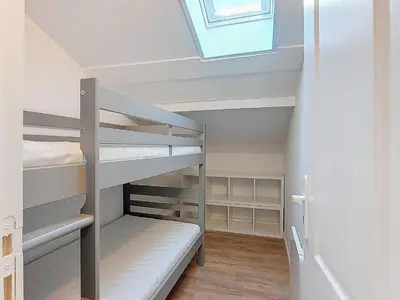 Un ou plusieurs lits dans un hébergement de l'établissement T3 duplex avec terrasse dans Résidence à Vieux-Boucau, piscine saisonnière - FR-1-857-37