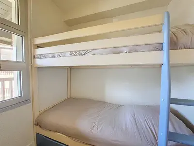 Un ou plusieurs lits dans un hébergement de l'établissement Vieux Boucau : T2 Cabine 6 Pers avec Piscine, Parking - FR-1-857-34