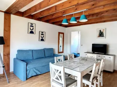 Coin salon dans l'établissement Soustons Plage - Villa Duplex 6 pers avec terrasse - FR-1-857-32