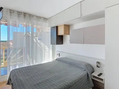 Un ou plusieurs lits dans un hébergement de l'établissement T2 4 pers avec terrasse, parking et piscine à Vieux Boucau - FR-1-857-42