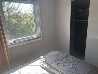 Un ou plusieurs lits dans un hébergement de l'établissement Mobil home au coeur des Landes Camping 4 étoiles