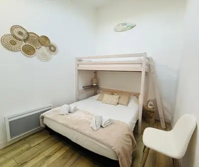 Un ou plusieurs lits dans un hébergement de l'établissement Studio Spa Du Bassin