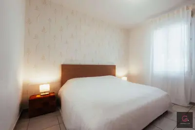 Un ou plusieurs lits dans un hébergement de l'établissement Biscarrosse centre Duplex avec terrasse 6 personnes
