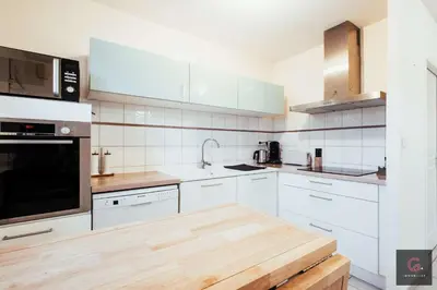 Cuisine ou kitchenette dans l'établissement Biscarrosse centre Duplex avec terrasse 6 personnes
