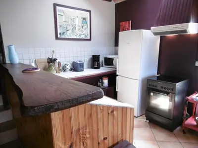 Cuisine ou kitchenette dans l'établissement Le coursin