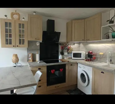 Cuisine ou kitchenette dans l'établissement Appartement cosy de Marie Lou