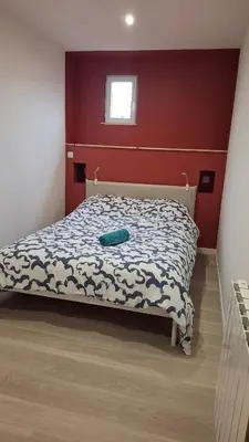 Un ou plusieurs lits dans un hébergement de l'établissement Bel appartement à Dax
