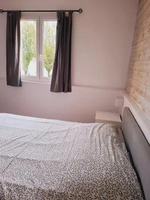 Un ou plusieurs lits dans un hébergement de l'établissement Maison et appartement 7 chambres, piscine