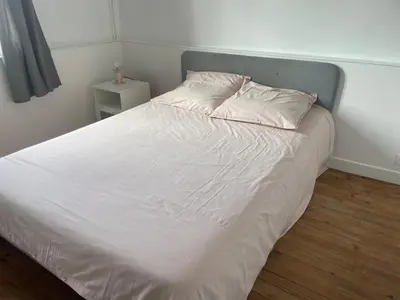 Un ou plusieurs lits dans un hébergement de l'établissement Maison et appartement 7 chambres, piscine