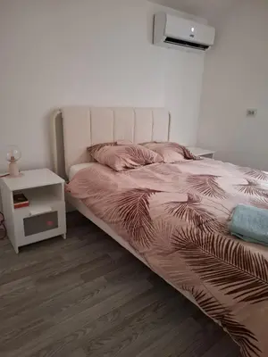 Un ou plusieurs lits dans un hébergement de l'établissement Ateka 2 appartements 4 chambres