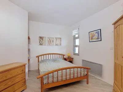 Un ou plusieurs lits dans un hébergement de l'établissement Appartement 5 pers avec piscine et parking à Vieux-Boucau - FR-1-857-61