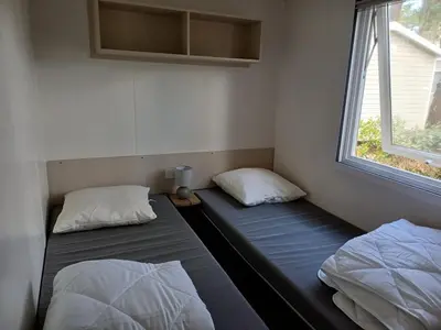 Un ou plusieurs lits dans un hébergement de l'établissement MH 6 à 8 personnes - Camping les Dunes de Contis