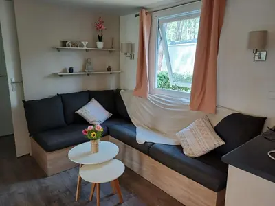 Coin salon dans l'établissement MH 6 à 8 personnes - Camping les Dunes de Contis
