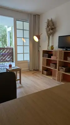 Télévision ou salle de divertissement dans l'établissement Cosy MO-MAÂ Golf, Océan et Plages