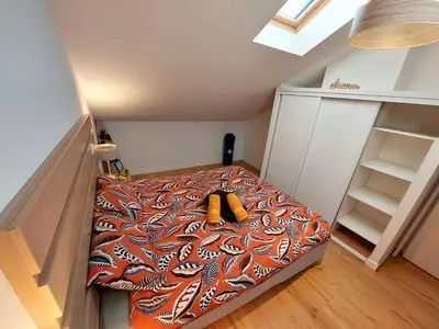 Un ou plusieurs lits dans un hébergement de l'établissement Plage 50M piscine parking spa Duplex cosy 6 pers