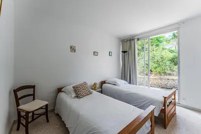Un ou plusieurs lits dans un hébergement de l'établissement Maison au coeur des pins
