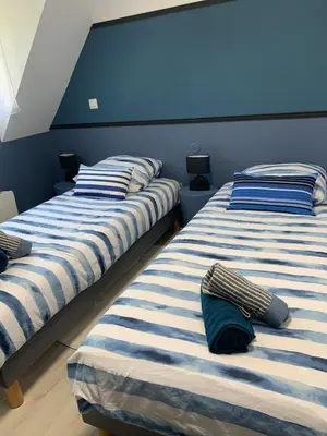 Un ou plusieurs lits dans un hébergement de l'établissement La Suite Unique - Cottage cosy - 2 chambres - vue Golf - 10 mn des Thermes - Linge inclus-