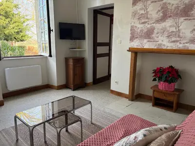 Télévision ou salle de divertissement dans l'établissement Chateau du Rau apt2