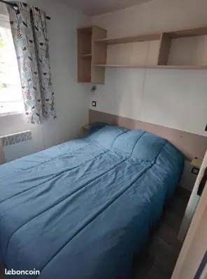 Un ou plusieurs lits dans un hébergement de l'établissement Mobil home Seignosse