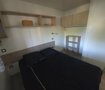 Un ou plusieurs lits dans un hébergement de l'établissement Mobilhome 5 PLACES