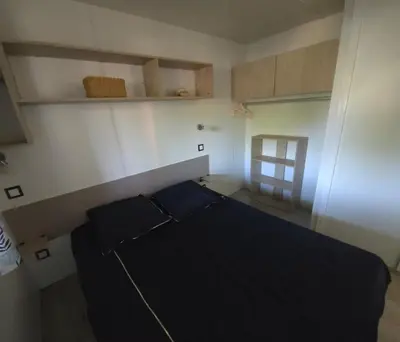 Un ou plusieurs lits dans un hébergement de l'établissement Mobilhome 5 PLACES
