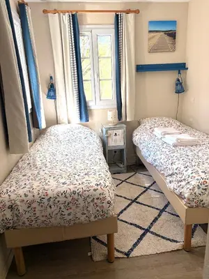 Un ou plusieurs lits dans un hébergement de l'établissement Maison villa Lilou , avec piscine, sur le golf, plage à 10 min à pied