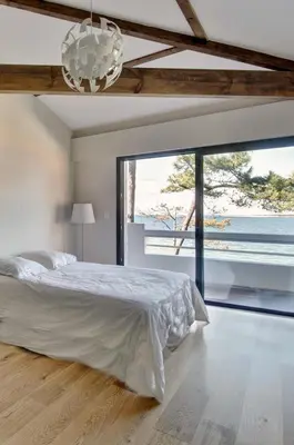 Un ou plusieurs lits dans un hébergement de l'établissement Villa MOANA - Archik - Accès plage
