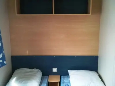 Un ou plusieurs lits dans un hébergement de l'établissement Mobil home confortable avec terrasse - API-1-52-1614