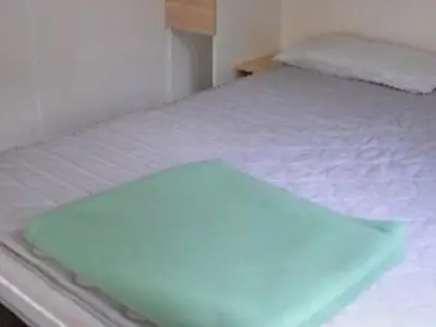 Un ou plusieurs lits dans un hébergement de l'établissement Mobil Home Famille 6 Pers. avec Terrasse - API-1-52-1644
