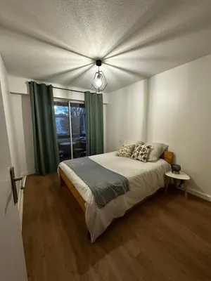 Un ou plusieurs lits dans un hébergement de l'établissement Appartement Soustons Les marronniers