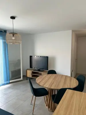 Télévision ou salle de divertissement dans l'établissement Appartement T3 à Mimizan Plage - 4 personnes