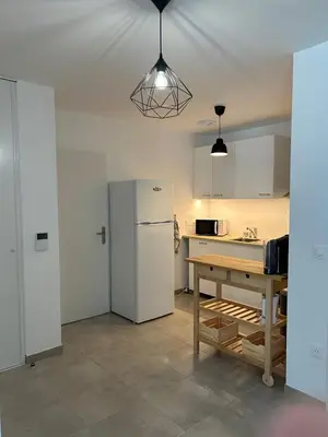 Cuisine ou kitchenette dans l'établissement Appartement T3 à Mimizan Plage - 4 personnes
