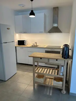 Cuisine ou kitchenette dans l'établissement Appartement T3 à Mimizan Plage - 4 personnes