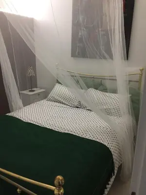 Un ou plusieurs lits dans un hébergement de l'établissement Villa piscine urt