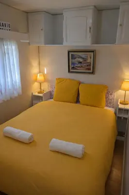 Un ou plusieurs lits dans un hébergement de l'établissement Mobil-Home La Pointe 5 pers camping 4 étoiles
