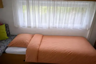 Un ou plusieurs lits dans un hébergement de l'établissement Mobil-Home La Pointe 5 pers camping 4 étoiles