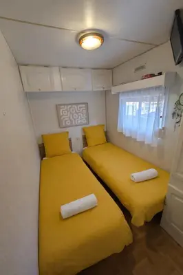 Un ou plusieurs lits dans un hébergement de l'établissement Mobil-Home La Pointe 5 pers camping 4 étoiles
