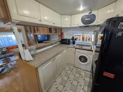Cuisine ou kitchenette dans l'établissement Mobil-Home La Pointe 5 pers camping 4 étoiles