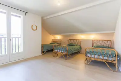 Un ou plusieurs lits dans un hébergement de l'établissement Villa Okeanis