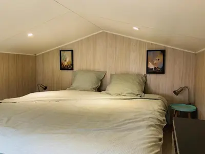 Un ou plusieurs lits dans un hébergement de l'établissement Adorable tiny-house