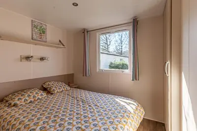 Un ou plusieurs lits dans un hébergement de l'établissement Mobilhome Le Coin Bonheur