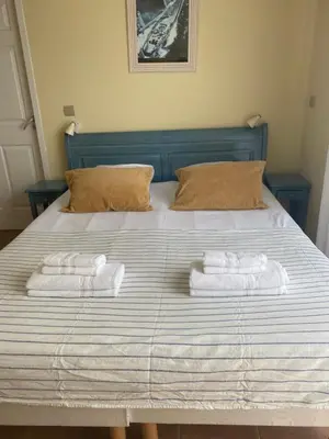 Un ou plusieurs lits dans un hébergement de l'établissement Maison avec piscine du golf de Gujan