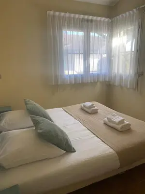 Un ou plusieurs lits dans un hébergement de l'établissement Maison avec piscine du golf de Gujan