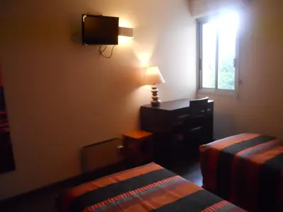 Un ou plusieurs lits dans un hébergement de l'établissement hotel la siesta