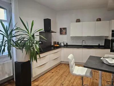Cuisine ou kitchenette dans l'établissement Appartement de charme au coeur de Salies de Béarn- Art, musique et lumière au confort premium