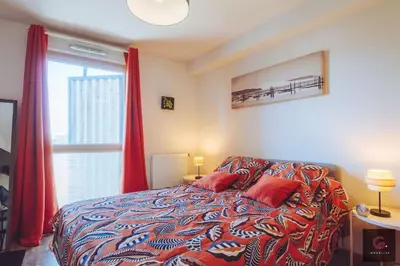 Un ou plusieurs lits dans un hébergement de l'établissement Appartement cosy avec balcon au cœur de Biscarrosse
