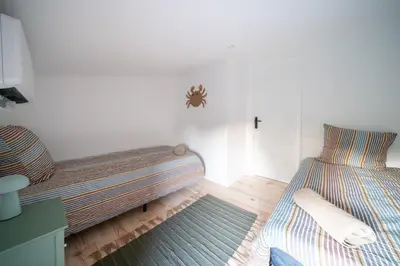Un ou plusieurs lits dans un hébergement de l'établissement Maison avec Spa et Accès direct au Lac de Cazaux
