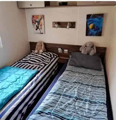 Un ou plusieurs lits dans un hébergement de l'établissement Mobil home