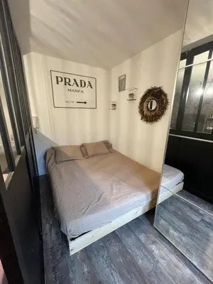 Un ou plusieurs lits dans un hébergement de l'établissement Studio loft city center
