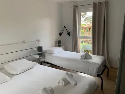 Un ou plusieurs lits dans un hébergement de l'établissement Villa d'Exception 7 chambres au coeur du golf de Biscarrosse